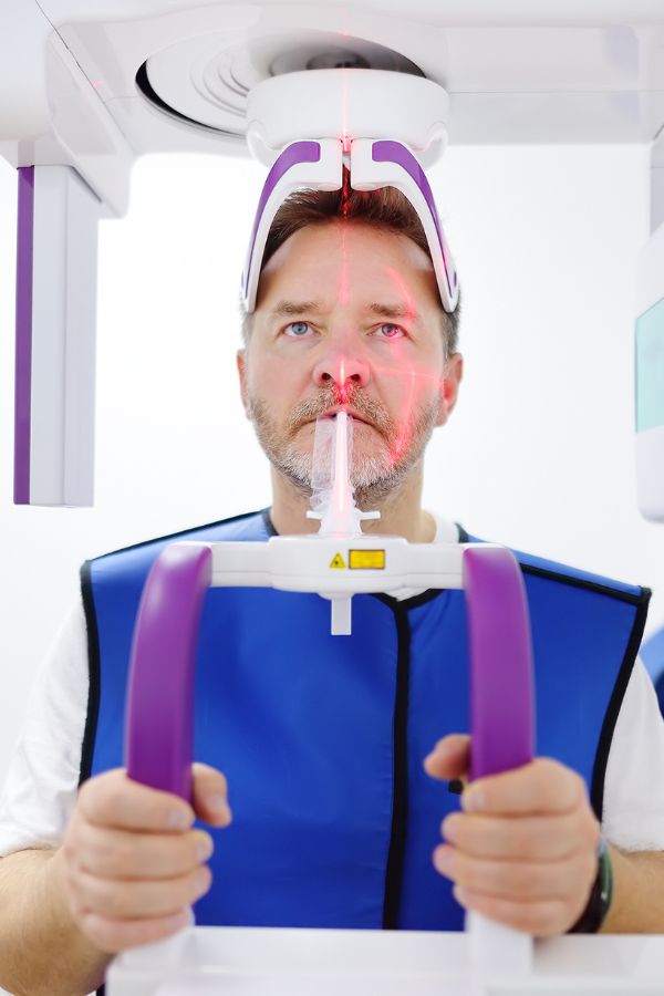 Dental X-ray being reviewed on a monitor before treatment