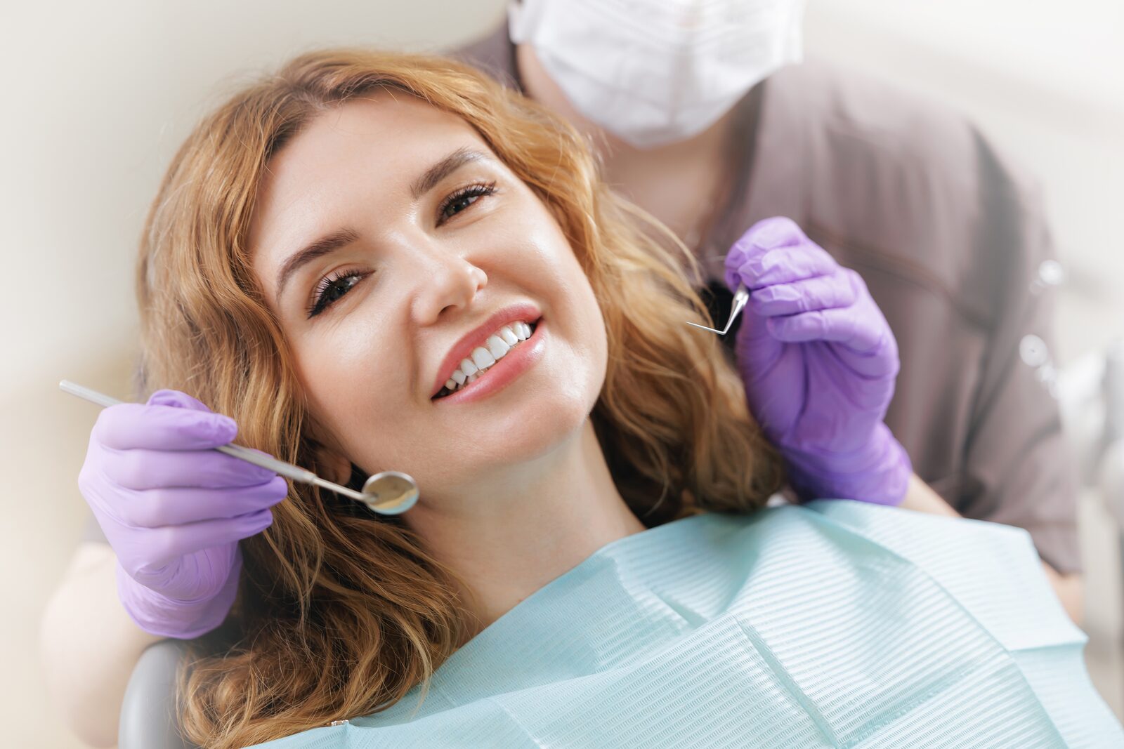 Smiling patient with healthy gums at a dental checkup